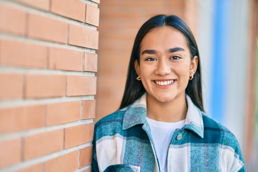 Woman smiling outdoors near White Rock, New Mexico